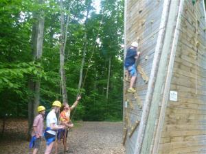 Campers support one another during High Ropes